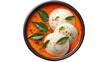 © Ferdoushi - A plate of idli with a small bowl of red sauce and basil garnishings
