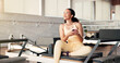 © peopleimages.com - Thinking, smartphone and woman in studio, fitness and relax with digital app to track progress. Decision, connection and healthy person in wellness center, cellphone and social media with internet