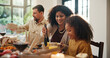 © peopleimages.com - Thanksgiving, help and serve with family in dining room for holiday season, eating or tradition. Festive feast, party and event with parents and child in home for food, hosting and hospitality