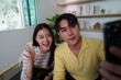 © itchaznong - Friendly Interaction. Young couple capturing a selfie while enjoying time together.