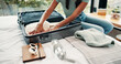 © Pixi/peopleimages.com - Hands, packing and suitcase with traveler in bedroom of home for holiday, trip or vacation. Clothes, getting ready and luggage bag with tourist person on bed in apartment for travel preparation