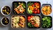 © ROSIANA - Grilled Salmon Meal Prep Containers with Couscous, Vegetables, and Olives on Grey Surface