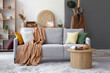 © Pixel-Shot - Interior of living room with grey sofa and table