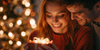 © Milan - Happy young couple sharing a magical Christmas moment with a glowing gift. Woman smiling while receiving a holiday present