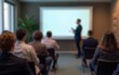 © Harper - Audience Watching a Presentation. Defocused Blurred Presenter During Conference Meeting. High quality