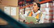 © peopleimages.com - Woman, reading and box with tablet in warehouse for supply chain, shipping info and label update. Person, package and digital for inventory management, check stock and cargo inspection for delivery