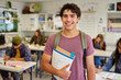 © Rido - Smiling latin student in classroom during lesson
