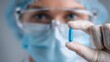 © Prapan - Medical Marvel: A focused medic showcases a vibrant blue capsule, offering a glimpse into medical advancement and healthcare innovation.