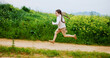 © peopleimages.com - Excited, running and space with girl outdoor in countryside for child development or growth. Adventure, energy and path with happy kid in green nature for activity, journey or wilderness experience