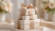 © Natalia S. - Stack of beige gift boxes with satin ribbon arranged as elegant tower, representing luxury celebration and premium wedding or event packaging concept. Soft neutral color palette emphasizes elegance