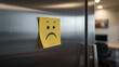 © TheWaterMeloonProjec - Yellow note on refrigerator featuring a frowning face, evokes feelings of disappointment