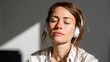 © fotogurme - Serene Caucasian woman absorbed in music, headphones cocooning tranquility, perfect for World Listening Day, meditative escape