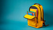 © Ansar - Yellow backpack filled with books and school supplies on blue background symbolizing education and learning