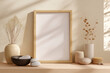 © mei - 柔らかな自然光が差し込むベージュトーンの空間に置かれた木製フレームとドライフラワー。穏やかで温かみのあるナチュラルインテリア構図。