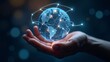 © Marfanita - Person holding glowing digital globe representing global technology and connection