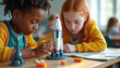 © miss irine - Children build model rocket in STEM class. Young engineers focus on science project, learning about space exploration and future tech. Diverse group works together on educational task.