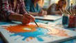 © miss irine - People paint canvas in art class creating abstract designs. Adults learn creativity, self expression, relaxation in workshop. Hand holds brush making colorful swirl patterns.