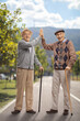 © Ljupco Smokovski - Senior men with walking canes making high five gesture