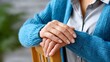 © Yuparet - Person’s hand in gentle care motion with elderly, Compassionate Caregiver Supporting Elderly Person Standing Up from Chair, Injury Prevention Concept with Copy Space