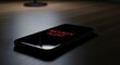 © Ednita - Urgent security alert on smartphone screen glowing red in dark