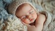 © Alex - Newborn baby sleeping peacefully wrapped in soft blanket under natural lighting conditions