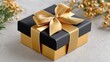 © Matcha_09 - Elegant black and gold gift box with shiny ribbon, perfect for celebrations, birthdays, holidays, or special occasions, surrounded by floral decorations and greenery