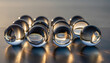 © Zikril - A group of clear glass marbles arranged in a grid pattern on a reflective surface.