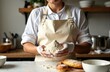 © starush - Woman holding flour in a kitchen setting with baking ingredients and utensils