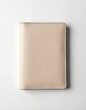 © miss irine - Beige leather passport holder for safe travel documents isolated on white. Elegant closed cover protects personal data with RFID blocking. Stylish accessory for id card, vacation, tourism, business