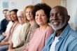 © Olha Havelia - diverse group of patients, male and female, different ethnicities, sitting in a waiting room of an eye clinic, showing unity and awareness around diabetes eye care
