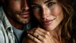 © Nat - A man and woman are embracing each other, with the woman wearing a diamond ring