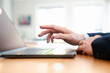 © Teelapon - Young man working on laptop at home office