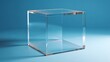 © Soklin - A transparent acrylic cube with a reflective surface, placed on a blue background with soft shadows.
