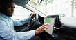 © Andrey Popov - Man Navigating With GPS Map On Car Dashboard As Auto Navigator
