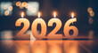 © Aurangzeb - Burning 2026 candles on wooden surface with bokeh lights in background