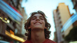 © A2Z AI  - A young person gazes upwards with a joyful smile in an urban setting, their expression reflecting hope and wonder as they observe the city's dynamic energy.