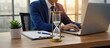 © STBSTD - Time Management in Office: A focused professional, working diligently at a desk, the subtle tick of a hourglass reflecting the urgency of deadlines.