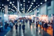 © Ifti Digital - Dynamic atmosphere at an abstract blurred tradeshow event showcasing various exhibits and engaging attendees during a busy industry convention