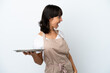© luismolinero - Young waitress with tray isolated on white background laughing in lateral position