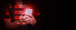© OleCNX - A man holding smartphone with hacking and phishing scam warnings on screen, symbolizing online fraud, call center scammer, cybercrime, data theft, and mobile security awareness.