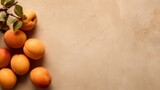 Minimalist layout of apricots on beige canvas