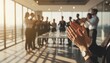 © Olga Gorkun - Business team applauding during a corporate meeting at sunset, symbolizing success, recognition, teamwork and leadership in a modern high-rise office environment