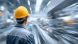 © pkproject - An engineer wearing a safety hard hat gazes into a dynamic motion blurred factory setting representing modern industrial processes efficiency and forward momentum in production
