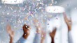 © กาซือมะ สาและ - cheerful coworkers celebrating project success, confetti flying in air, office teamwork
