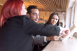 © as-artmedia - Business Meeting in a Modern Cafe – Teamwork and Collaboration Concept