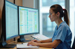 © Vadym - Young female medical pro works on computer. Uses dual monitors for data entry, analyzing health records, billing info. Woman wears blue scrubs, performs admin tasks in office managing patient data,