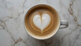 Cup of cappuccino with foam heart on a neutral-toned table