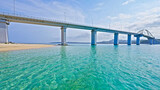 View of a marine bay with a bridge and turquoise waters