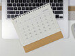 © Yusnizam Yusof - Minimalist desk setup with a 2026 January calendar placed on a laptop keyboard, concept of planning, scheduling, and time management for the new year.