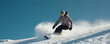 © Maryna - Female snowboarder rides downhill on snowy slope. Woman in winter sportswear enjoying extreme sport action at ski resort. Snowboarding on powder snow. Winter vacation concept.